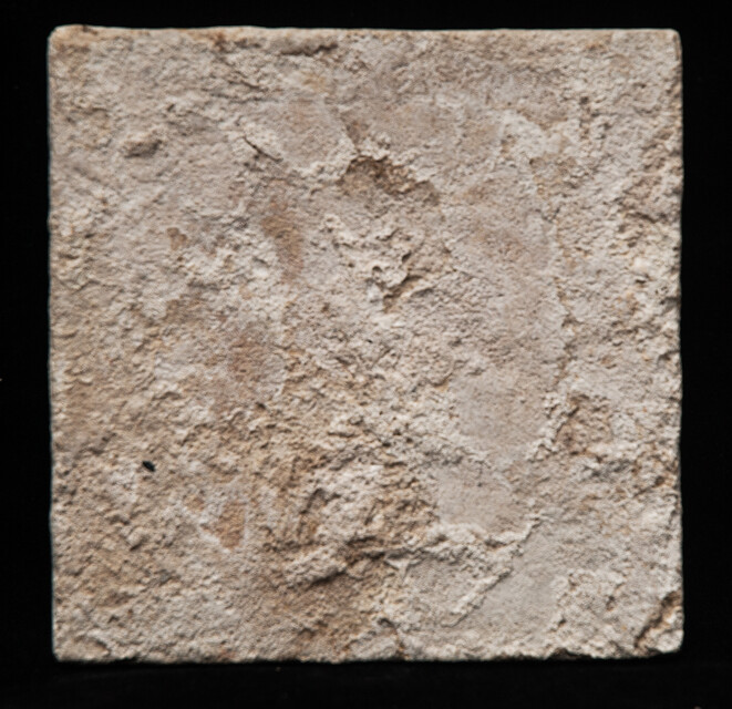 An 18th century Delft blue tile of a shepherd playing a shawm.