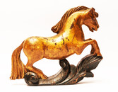 An 18th century Frisian wood carved and gilt rudder decoration in the form of a horse.