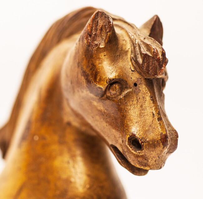 An 18th century Frisian wood carved and gilt rudder decoration in the form of a horse.