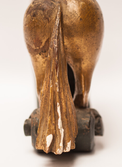 An 18th century Frisian wood carved and gilt rudder decoration in the form of a horse.