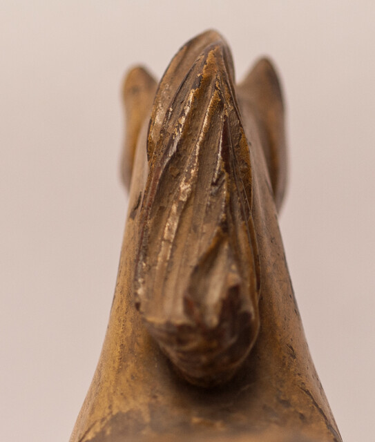 An 18th century Frisian wood carved and gilt rudder decoration in the form of a horse.