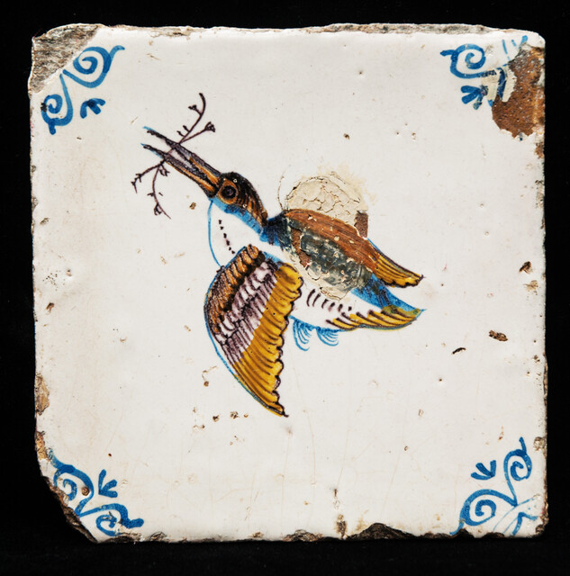 An early 17th C. coloured tile of a flying kingfisher.