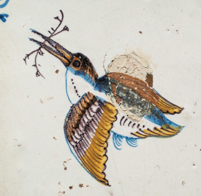 An early 17th C. coloured tile of a flying kingfisher.