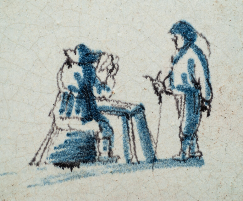 An early 17th C. Delft blue and manganese tile with two wool combers.