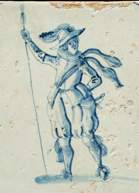 An early 17th C. Delft blue tile with an elegant soldier.