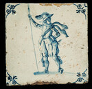 An early 17th C. Delft blue tile with an elegant soldier.