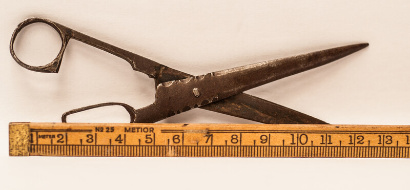 An early eighteenth century folding scissors with a blacksmiths touch mark.