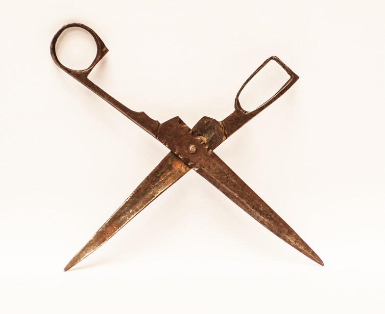 An early eighteenth century folding scissors with a blacksmiths touch mark.