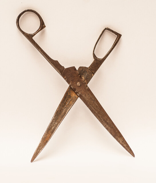 An early eighteenth century folding scissors with a blacksmiths touch mark.