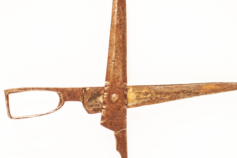 An early eighteenth century folding scissors with a blacksmiths touch mark.