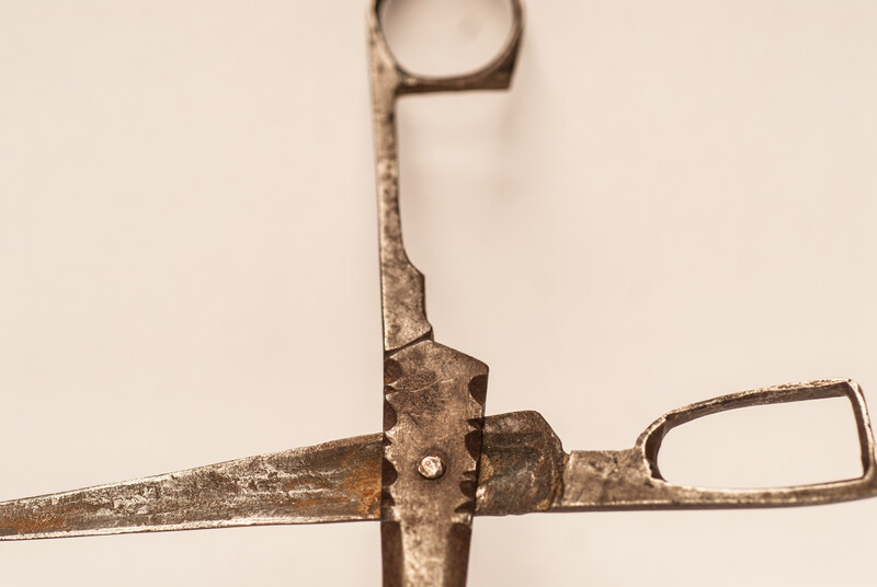 An early eighteenth century folding scissors with a blacksmiths touch mark.
