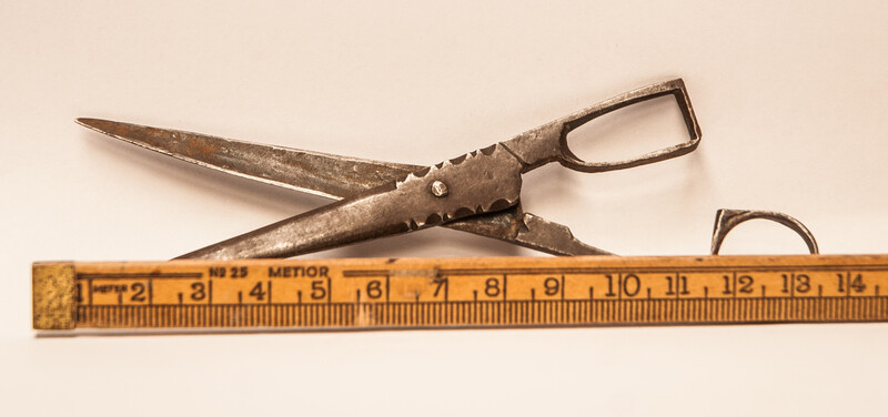 An early eighteenth century folding scissors with a blacksmiths touch mark.
