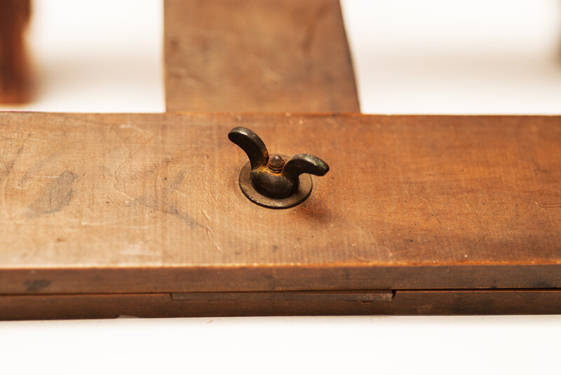 An early nineteenth century drawing hook with an attractive wing nut and signed 