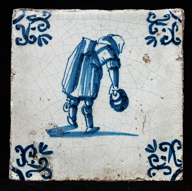 An early seventeenth century Delft blue tile with a Dutch proverb.