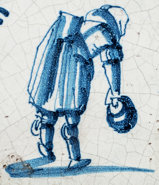 An early seventeenth century Delft blue tile with a Dutch proverb.