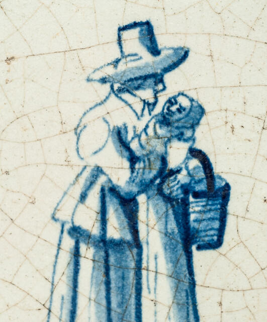 An early seventeenth century Delft blue tile with a nanny and a child.
