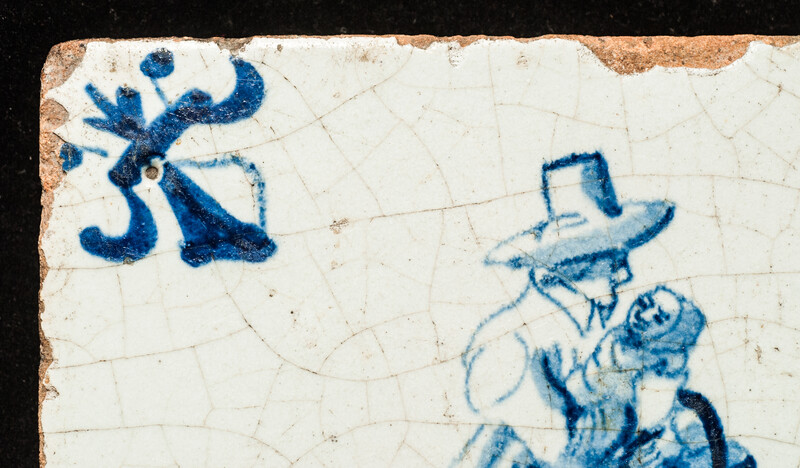 An early seventeenth century Delft blue tile with a nanny and a child.