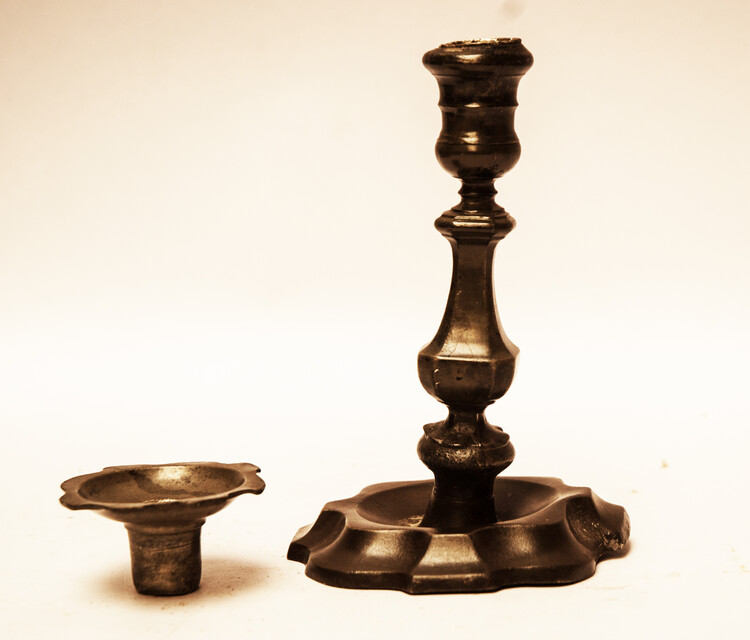 An early seventeenth century pewter candlestick.
