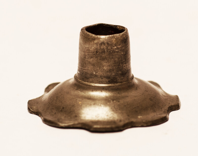 An early seventeenth century pewter candlestick.