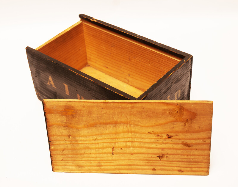 An eighteenth century apothecary box with text 