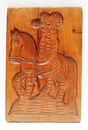 An eighteenth century double sided Dutch cookie mould with a man on a horse and on the other side a cow.