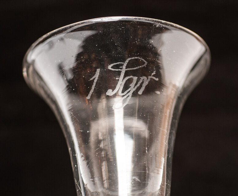 An eighteenth century Dutch glass tot with inscription for medical use.