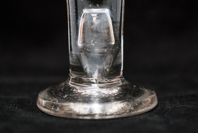 An eighteenth century Dutch glass tot with inscription for medical use.