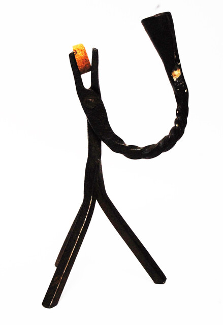 An eighteenth century Dutch rush clamp and candlestick.