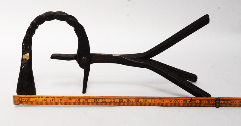 An eighteenth century Dutch rush clamp and candlestick.