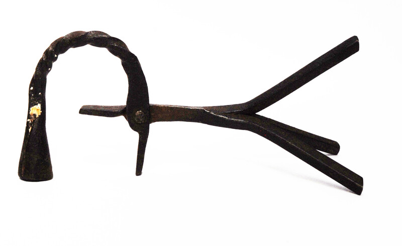 An eighteenth century Dutch rush clamp and candlestick.