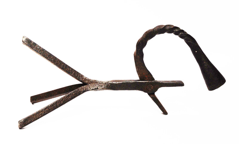 An eighteenth century Dutch rush clamp and candlestick.