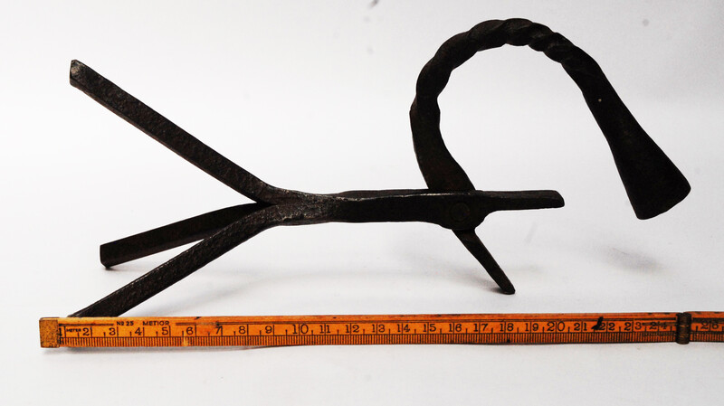 An eighteenth century Dutch rush clamp and candlestick.