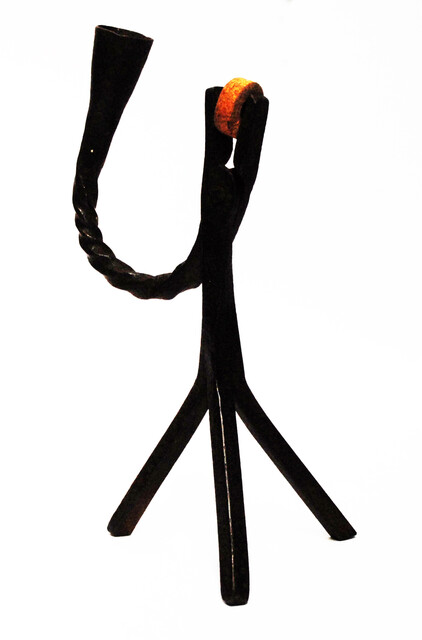 An eighteenth century Dutch rush clamp and candlestick.