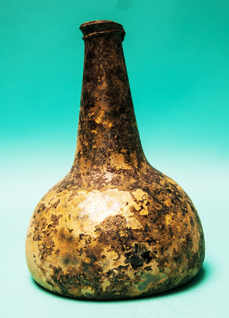 An eighteenth century Dutch wine bottle  from a shipwreck in a tropical sea.