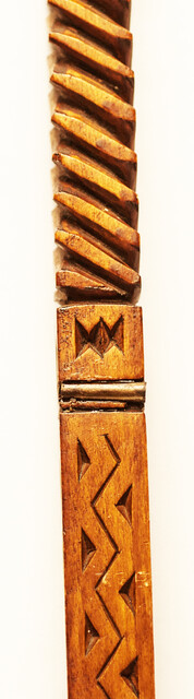 An extensively carved Dutch wooden ellrule with a brass stop.