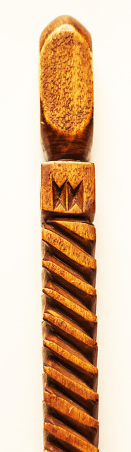 An extensively carved Dutch wooden ellrule with a brass stop.