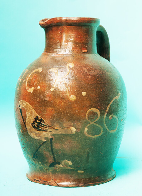 An extremely rare large jug, with initials, a bird and dated 1786.