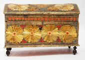 An Seventeenth Century small box decorated with flower leaves and a stylized butterfly.