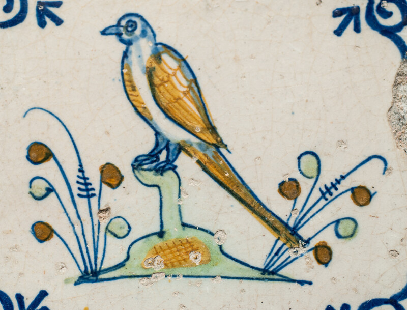 Eight very rare early 17th C Delft coloured tiles with birds.