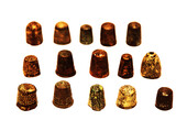 Fifteen Dutch thimbles all from an early seventeenth excavation site in Amsterdam.