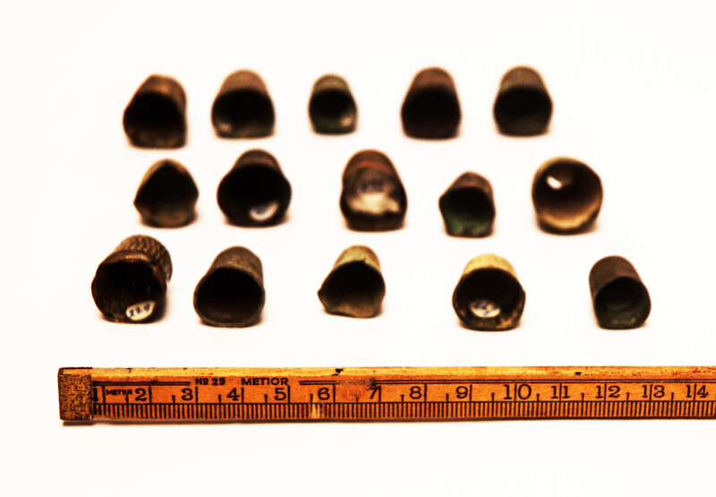 Fifteen Dutch thimbles all from an early seventeenth excavation site in Amsterdam.