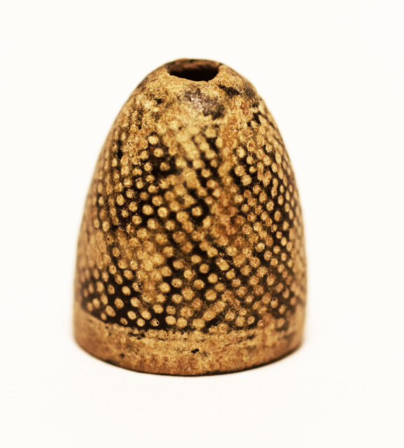 Fifteen Dutch thimbles all from an early seventeenth excavation site in Amsterdam.