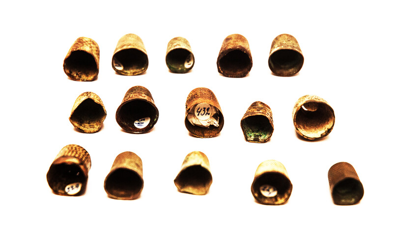 Fifteen Dutch thimbles all from an early seventeenth excavation site in Amsterdam.