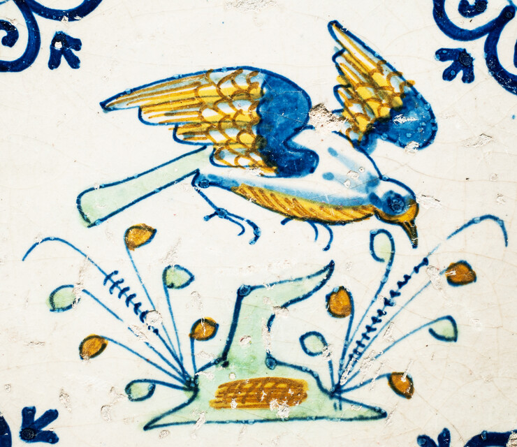 Four extremely rare early 17th C. multicoloured Gouda tiles with birds.