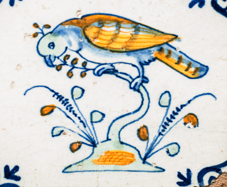 Four extremely rare early 17th C. multicoloured Gouda tiles with birds.