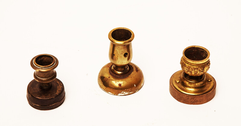 Three attractive brass 19th century small composed candle sticks.