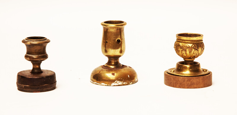 Three attractive brass 19th century small composed candle sticks.