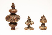 Three bronze flame shaped top ornaments.