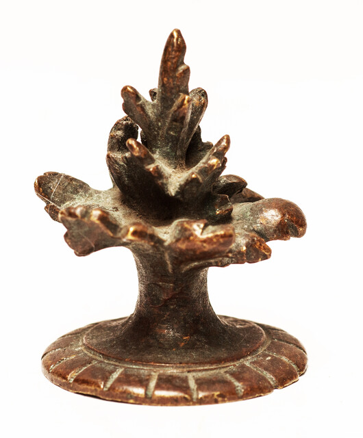 Three bronze flame shaped top ornaments.