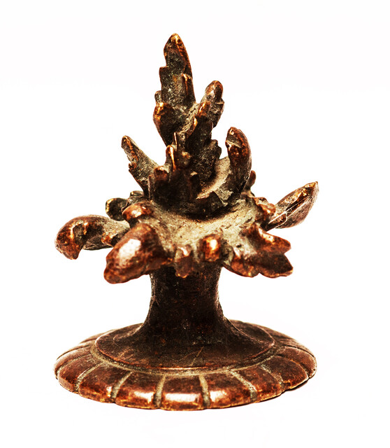 Three bronze flame shaped top ornaments.